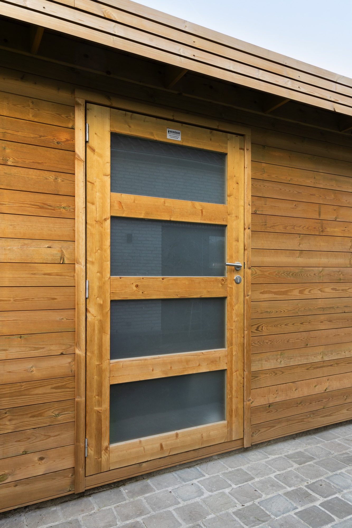 Tuinberging met opendraaiende deur met plexiglas