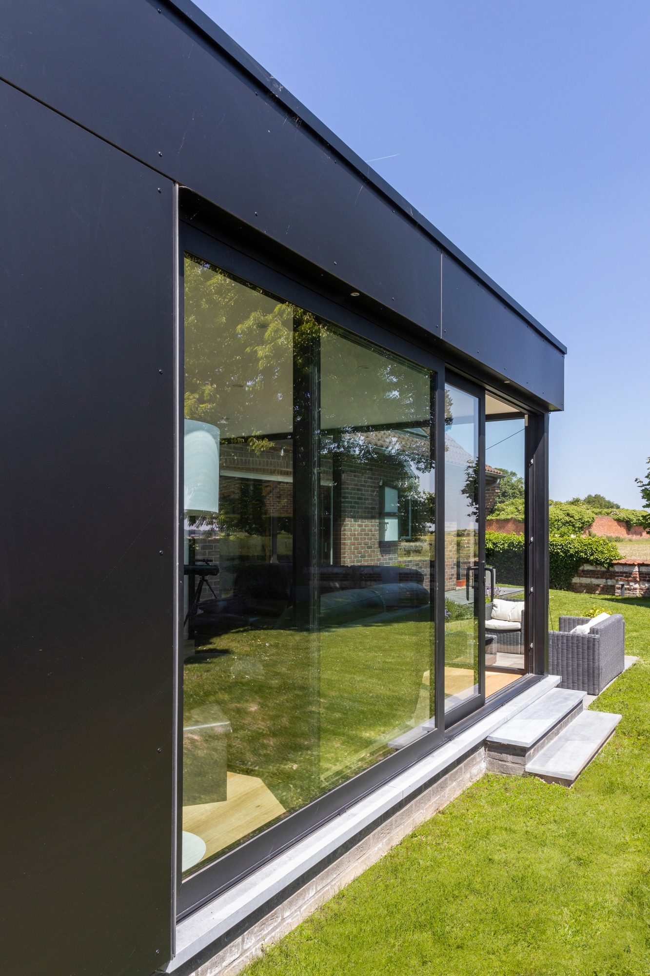 Extension avec fenêtres coulissantes