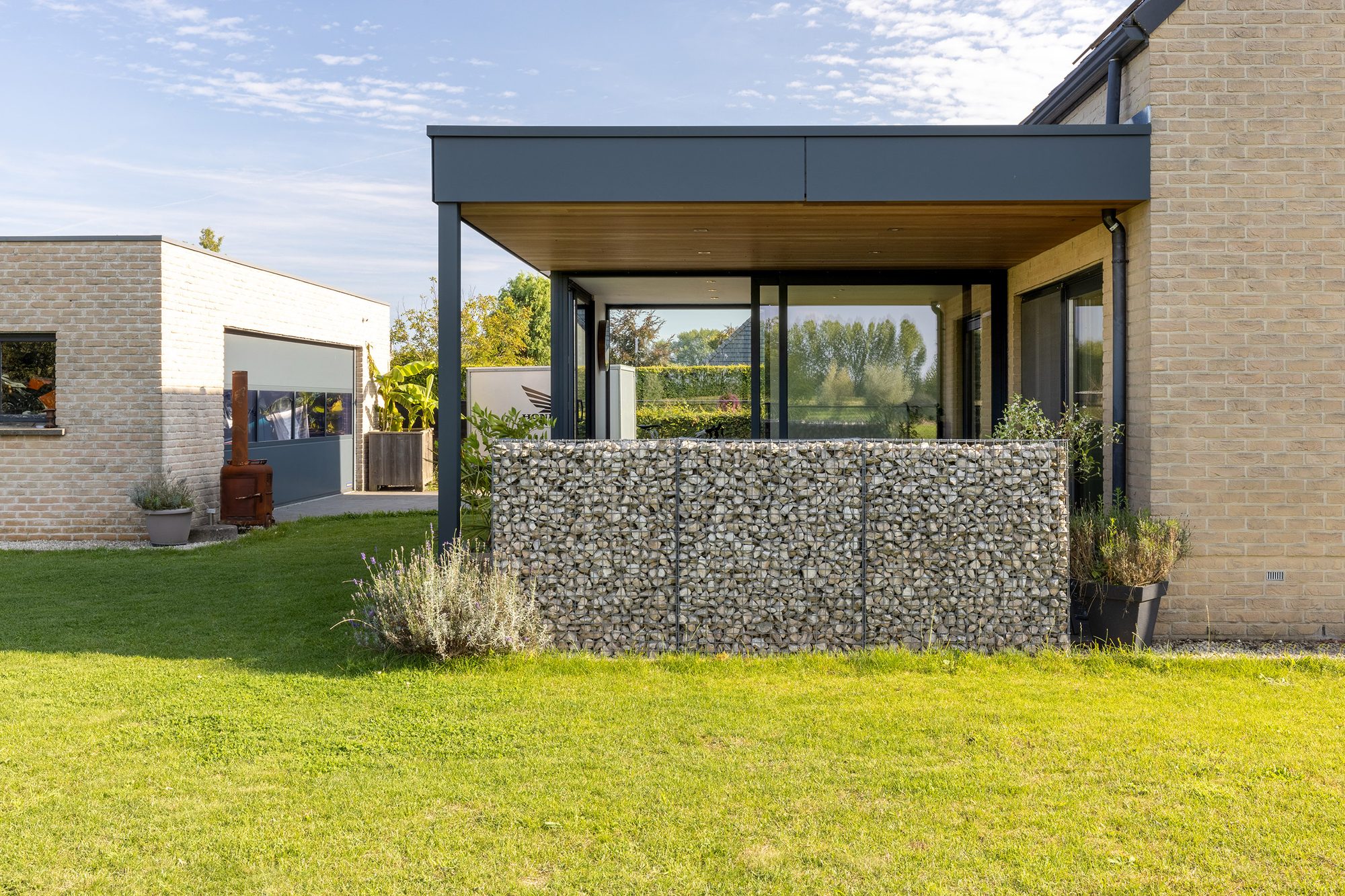Véranda avec pergola