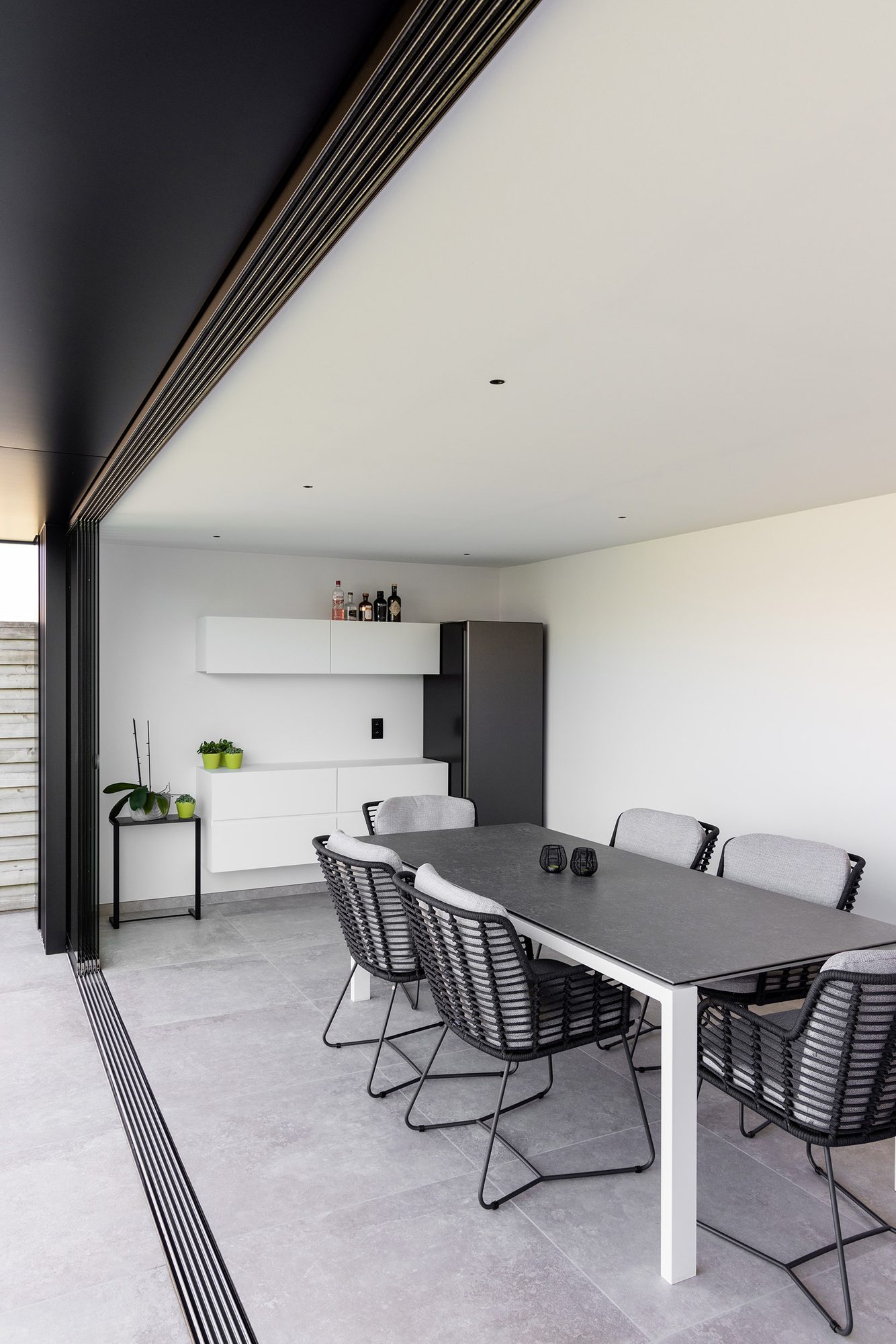 Tuinkamer met Sunflex glazen schuifwand